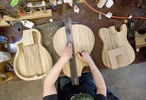 &lt;p&gt;Hamilton works on a guitar in his home shop. He uses woods with exotic names such as black limba, quilted maple and madagascar ebony.&lt;/p&gt;