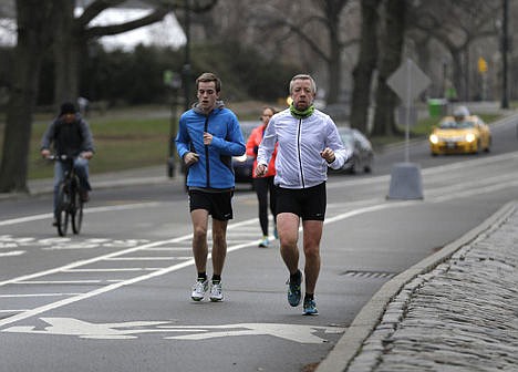 &lt;p&gt;Joggers run through Central Park in New York, April 9.&lt;/p&gt;