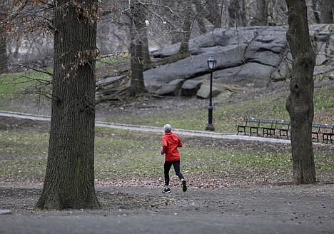 &lt;p&gt;A person takes a morning run through Central Park in New York, April 9.&lt;/p&gt;