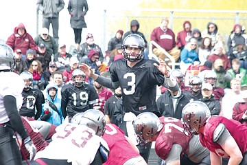 &lt;p&gt;Quarterback Brady Gustafson steps out from under center to call an audible during Saturday's scrimmage in Ronan.&lt;/p&gt;