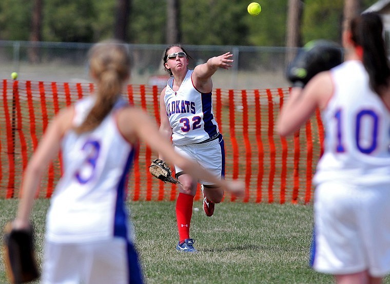 Michonne Cronquist throws the ball in to teammates Ranae Nelson (3) and Niki Birky (10) during the first game of a doubleheader against Havre Saturday afternoon.