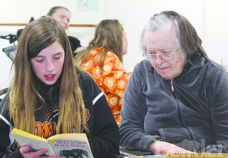 &lt;p&gt;Eva Miller reads to Adeline Matt at Mission View Care Center in Ronan last week. Miller is one of several Boys &amp; Girls Club of the Flathead Reservation and Lake County members who reads to care center residents on a regular basis.&lt;/p&gt;