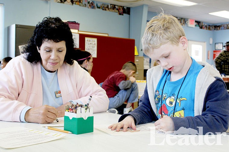 &lt;p&gt;Evonne Wall, a foster grandparent, colors with Landon Bishop at the Boys &amp; Girls Club of the Flathead Reservation and Lake County last week in Ronan.&lt;/p&gt;