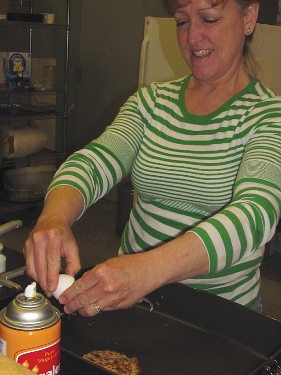 Owner Anita Brown  prepares a toasted Panini breakfast sandwich at Hot Brews, which has been combined with Tiddaly Diddaly's into one business at the Port of Mattawa Industrial/Commercial Park on Road 24 SW.