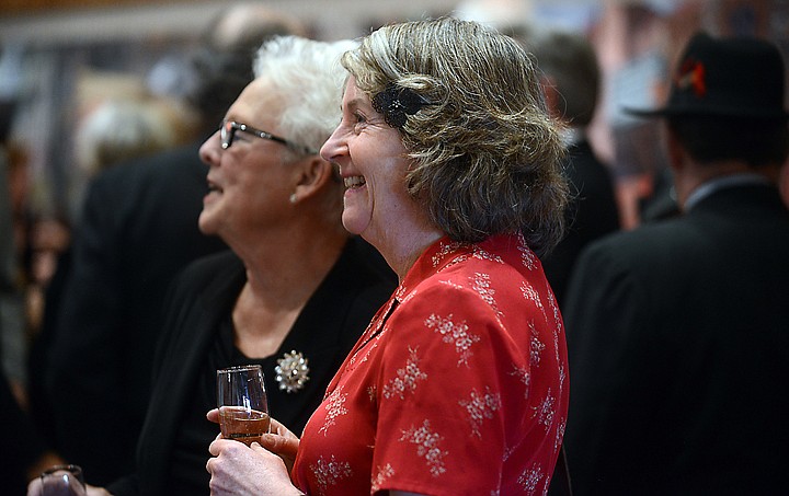 <p>Carol Bibler and others gather in the foyer prior to the Flathead Valley Community College spring fundraiser "Casablanca the Dinner" on Saturday, April 12, in Kalispell. One hundred and fourteen people attended this year's dinner. This is the third annual spring dinner. Past events featured a Titanic theme and an April in Paris theme last year. (Brenda Ahearn/Daily Inter Lake)</p>