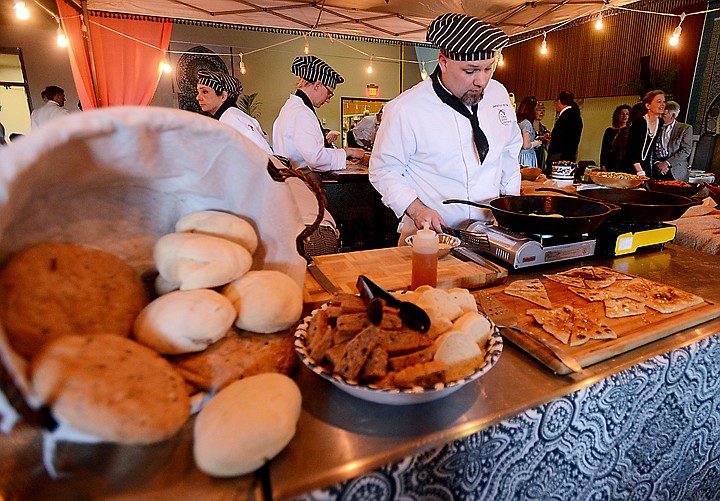 <p>Culinary Arts student Jonathon Hartig made a selection of breads for the Flathead Valley Community College spring fundraiser "Casablanca the Dinner" on Saturday, April 12, in Kalispell. The breads were a Classic Moroccan Round, a Black Olive, Red Onion and Walnut bread, and a Layered Berber Flatbread. "Bread making has become my main responsibility at both Chefs table and the special events," said Hartig. "Baking bread has been a passion of mine since I was young. My grandfather was from Italy and taught us how to bake breads when we were growing up,...it's always been a very calming process for me and seems to connect me back to my heritage." (Brenda Ahearn/Daily Inter Lake)</p>