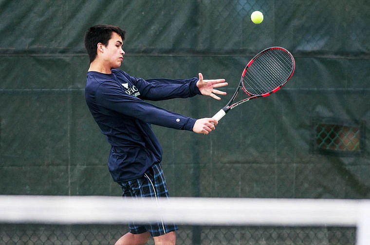 &lt;p&gt;Glacier's Hunter Blalack returns a serve with a backhand Friday afternoon during a crosstown tennis match between Glacier and Flathead at Flathead Valley Community Collge. April 18, 2014 in Kalispell, Montana. (Patrick Cote/Daily Inter Lake)&lt;/p&gt;