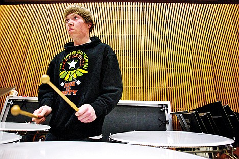 &lt;p&gt;Nick Keough keeps his eye on the conductor as he plays through his section on the kettledrums Wednesday during the rehearsal of the North Idaho College Wind Symphony.&lt;/p&gt;