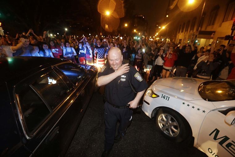 &lt;div id=&quot;prtlt&quot;&gt;
&lt;p&gt;A police officer and a crowd gathered around him react to news of the arrest of one of the Boston Marathon bombing suspects on Friday, April 19, 2013, in Boston. Dzhokhar Tsarnaev was captured in Watertown, Mass. The 19-year-old college student wanted in the bombings was taken into custody Friday evening after a manhunt that left the city virtually paralyzed and his older brother and accomplice dead.&#160;&lt;/p&gt;
&lt;div&gt;&#160;&lt;/div&gt;
&lt;/div&gt;
&lt;div id=&quot;summary&quot;&gt;&lt;a name=&quot;summary&quot; id=&quot;summary&quot;&gt;&lt;/a&gt;&lt;/div&gt;