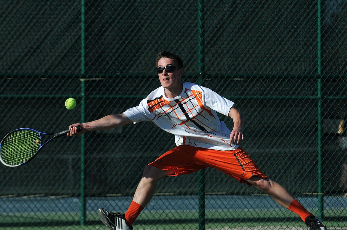 &lt;p&gt;Flathead's Ridge Lembka stretches for a ball during a singles match against Glacier's Spencer Johnson at Flathead Valley Community College on Tuesday. (Aaric Bryan/Daily Inter Lake)&lt;/p&gt;