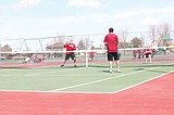 Huskies girls win tennis dual; boys fall short