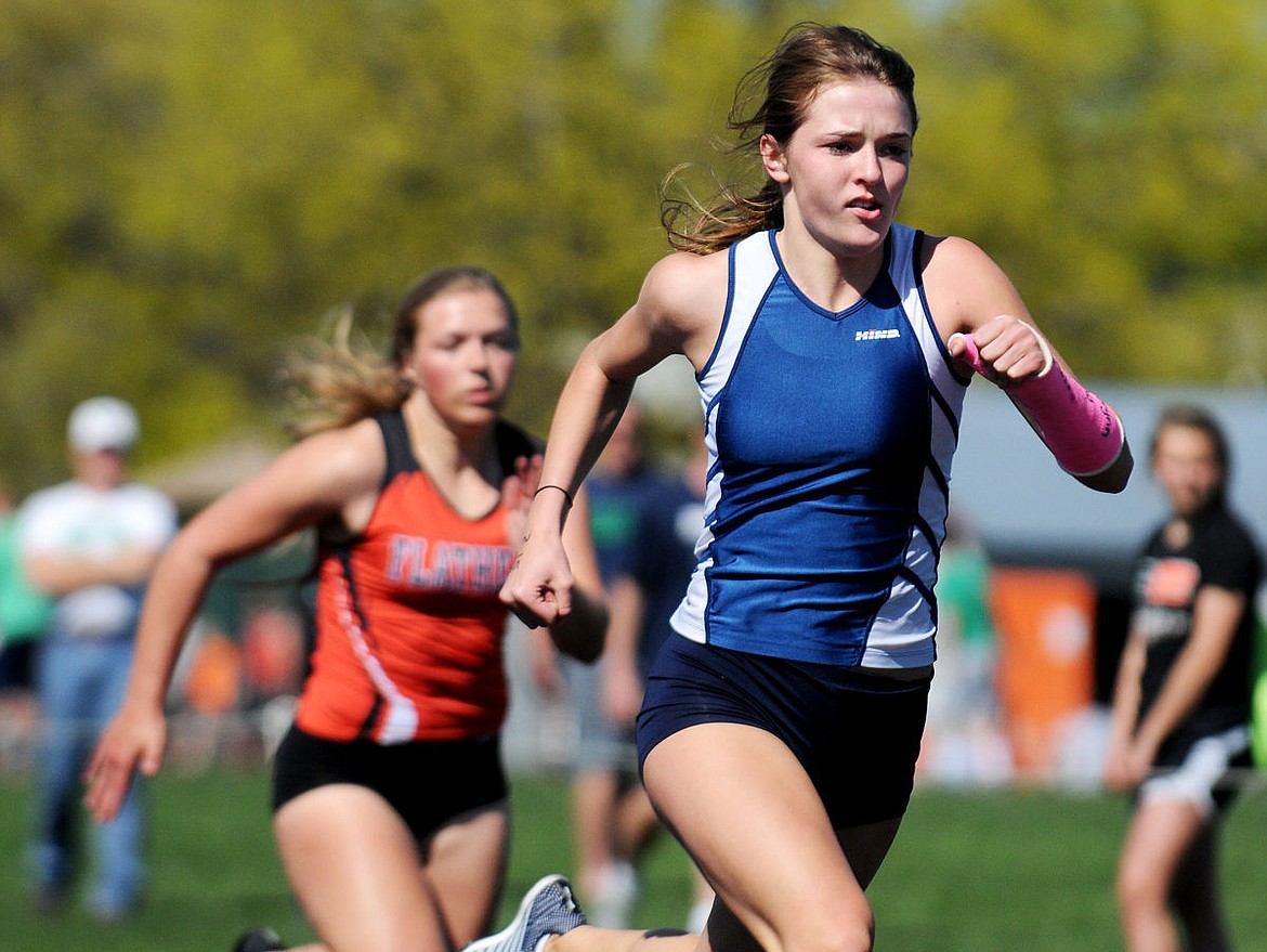 <p>Glacier junior Ahna Kreitinger speeds toward the finish line to win the 100-meter dash with a time of 13.37 seconds during the Crosstown Track meet at Legends Stadium on Tuesday. (Aaric Bryan/Daily Inter Lake)</p>