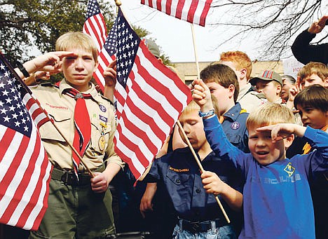 &lt;p&gt;From left, Joshua Kusterer, 12, Nach Mitschke, 6, and Wyatt Mitschke, 4, salute as they recite the pledge of allegiance during the Save Our Scouts prayer vigil and rally against allowing gays in the organization in front of the Boy Scouts of America National Headquarters in Dallas, Texas, on Feb. 6.&lt;/p&gt;