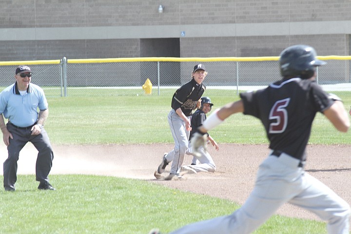 Second baseman Brady Dixon of Royal High School gets the out at second and relays the ball to first base for a double  play in South Central A Conference East baseball action at Wahluke on Saturday.