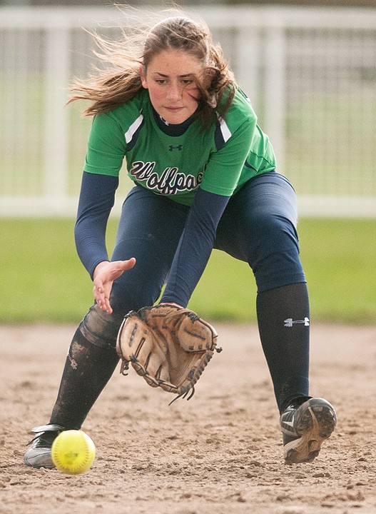 <p>Glacier second baseman Katie McHugh fields a ball during the first game of a crosstown softball doubleheader at Conrad Complex Friday afternoon. </p>