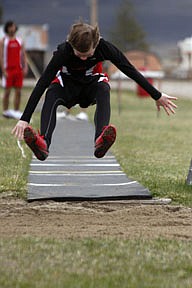 Savage Heat freshman Jarod White competes in the long jump during Hot Springs' home meet on Friday.