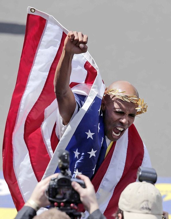 <p><strong>American Meb Keflezighi</strong> celebrates his victory in the 118th Boston Marathon Monday. (AP Photo/Charles Krupa)</p>