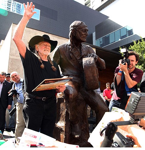 &lt;p&gt;Country singer Willie Nelson waves during the unveiling of an eight-foot statue of himself, Friday, April 20, 2012 in Austin, Texas. The privately-funded monument near the new Moody Theater shows Nelson in a relaxed, standing pose and holding his guitar to the side, as if in conversation. (AP Photo/Austin American-Statesman, Jay Janner) MAGS OUT; NO SALES; INTERNET AND TV MUST CREDIT PHOTOGRAPHER AND STATESMAN.COM&lt;/p&gt;