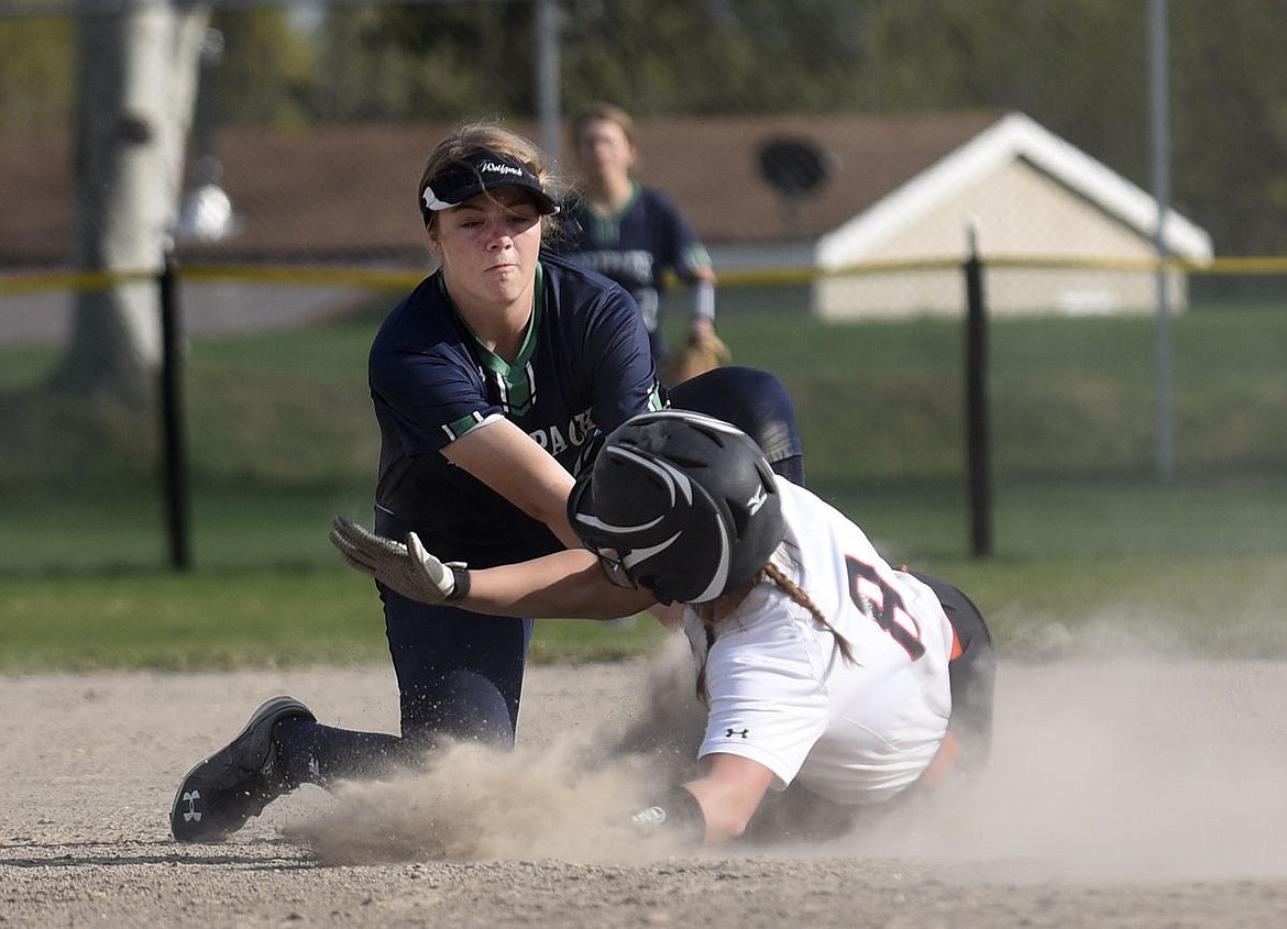 &lt;p&gt;Glacier shortstop Anna Schrade tags out Flathead centerfielder Kaitlin Torgerson as she tries to steal second in the second game of a doubleheader Thursday. (Aaric Bryan/Daily Inter Lake)&lt;/p&gt;