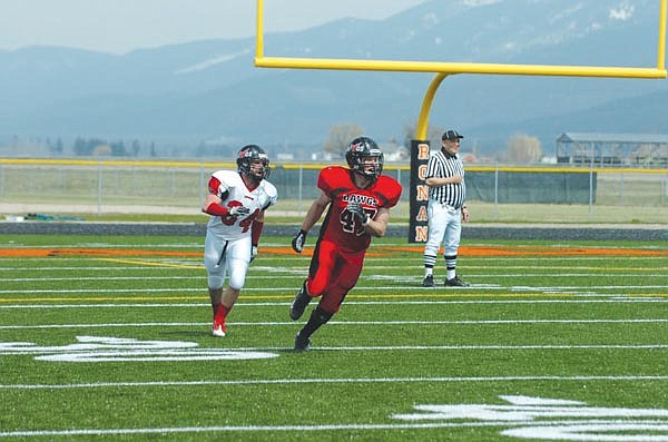 Andy Sieges, of Charlo, looks to make a tackle in the backfield.