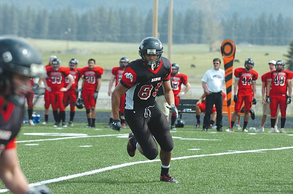 MaKenzy Kelch, of Polson, runs toward the ball carrier during the first half of the scrimmage.