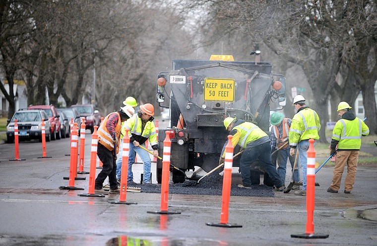 &lt;p&gt;Kalispell street workers perform road maintenance Thursday on First Avenue East near Fifth Street. Work on both First Avenue East and First Avenue West is expected to continue until May 16. Motorists should expect short delays with single-lane and one-block street closures.&lt;/p&gt;