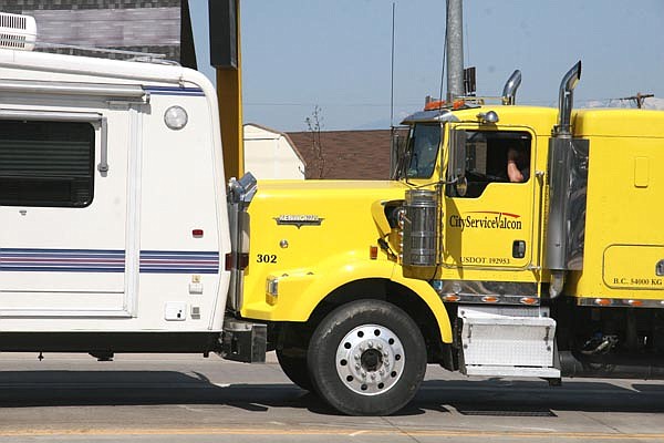 A tanker truck waiting at the light on Hwy 35 stopped the momentum of the camper and truck, which dragged its driver. The tanker had just finished unloading 10,000 gallons of jet fuel at the Kalispell airport.