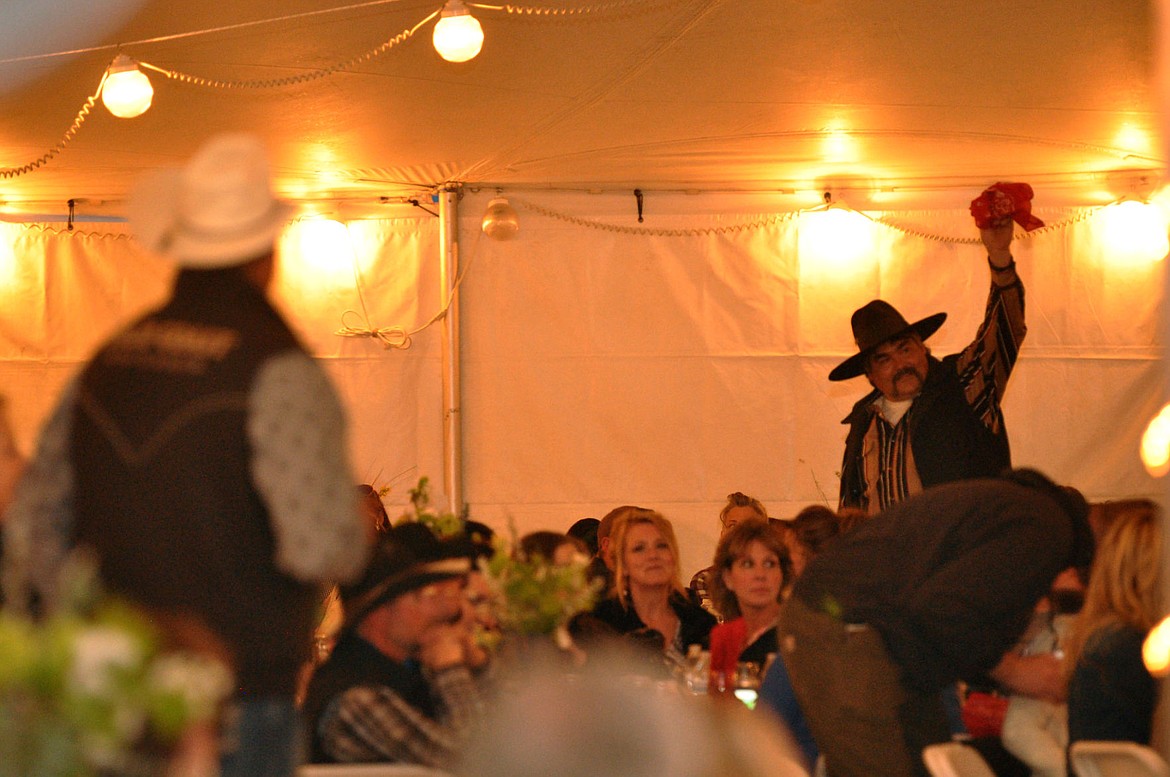 &lt;p&gt;Elliott Natz Lake County Leader Auctioneer Ringman, John Wall, yells to his auctioneer Reed Tobol during Cowboy Ball's live auction.&lt;/p&gt;