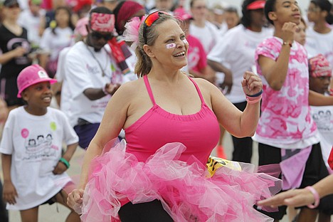 &lt;p&gt;In this April 14, 2012, photo Teresa Blackington of Alvaredo warms up before the Susan G. Komen Race for the Cure in Fort Worth, Texas. Organizers of Race for the Cure events across the country have reported drops in participation following a controversy involving Planned Parenthood. In Fort Worth, participation declined by 23 percent. (AP Photo/Star-Telegram, Joyce Marshall) MAGS OUT&lt;/p&gt;