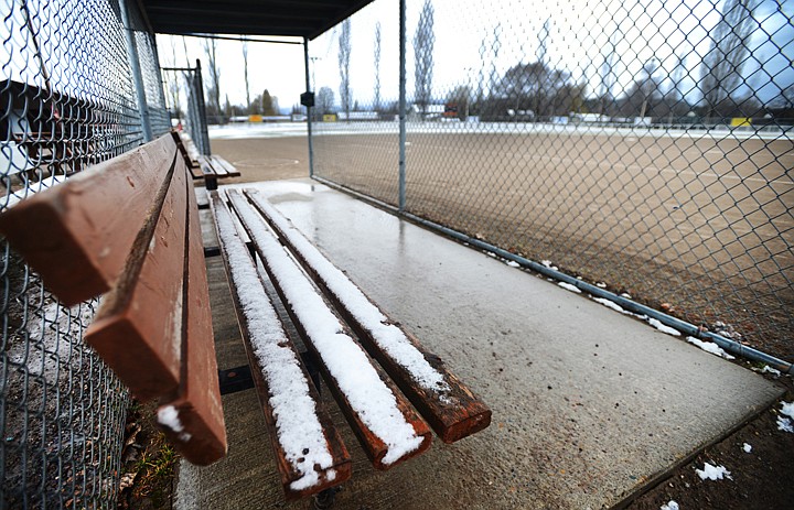 &lt;p&gt;Snow lightly covers the benches in the dugout at the Conrad Complex Saturday morning. Sporting events around the Flathead Valley were either postponed, or not completed, because of the weather. Flathead&#146;s softball games with Great Falls C.M. Russell and Great Falls High at the Conrad Complex were canceled.&lt;/p&gt;