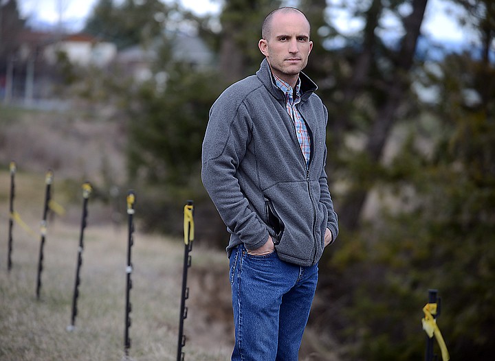 &lt;p&gt;Homeowner Scott Gearhart stands along a section of the bluff marked by stakes used to track the rate of ground movement on Wednesday, April 9, in Evergreen. (Brenda Ahearn/Daily Inter Lake)&lt;/p&gt;