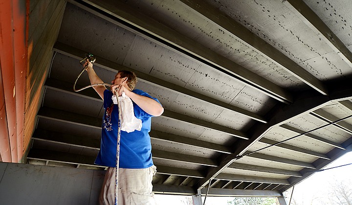 &lt;p&gt;Matt Stone, store manager at Sherwin-Williams, gives a new two-toned paint job to the pavilion at Lions Park on Tuesday, April 8, in Kalispell. (Brenda Ahearn/Daily Inter Lake)&lt;/p&gt;