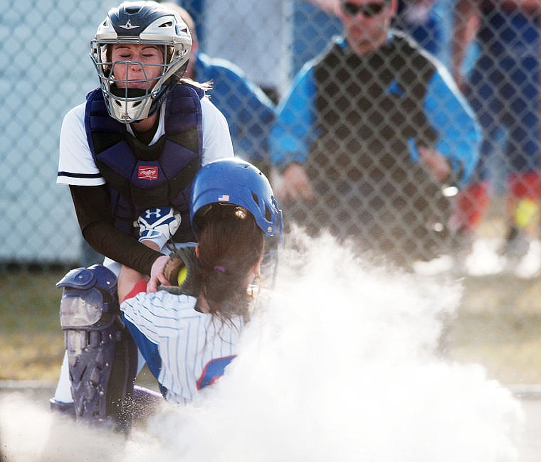 &lt;p&gt;Polson senior catcher Jaylin Kenney (left) tags out Columbia Falls senior Tiffany Hummer (5) at the plate in the third inning Tuesday night during the Wildkats' loss to Polson at Columbia Falls High School. April 8, 2014 in Kalispell, Montana. (Patrick Cote/Daily Inter Lake)&lt;/p&gt;