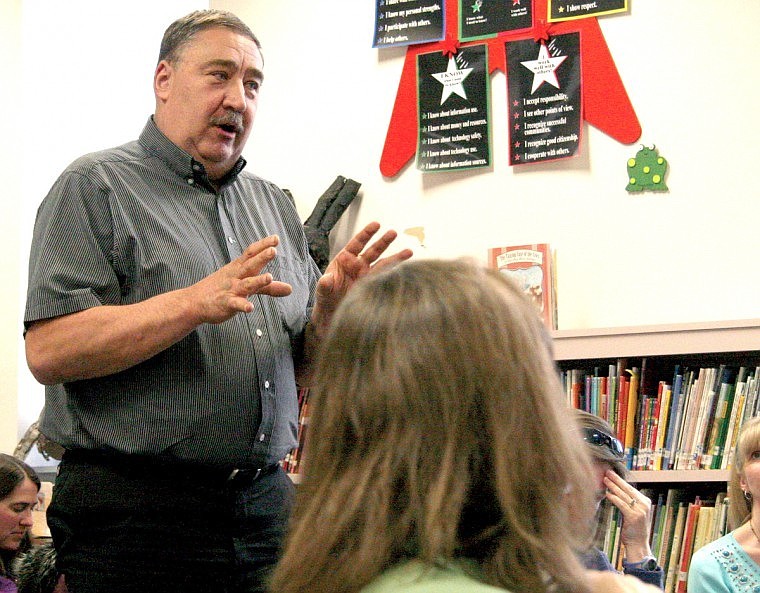 Polson Middle School teacher Charles Bertsch asked the board for clarification on the proposed personnel cuts.