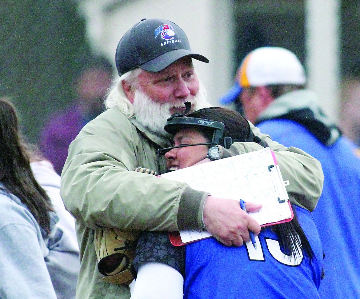 &lt;p&gt;Bob Erickson hugs Ran'Dee Charlo during their game in Libby last week.&lt;/p&gt;