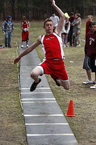 Brandon Piazzola of Noxon competes in the triple jumper. Piazzola won the event, with a leap of 17.1.