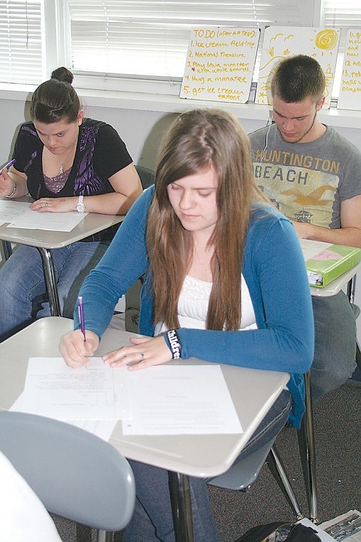 Moses Lake High School student Kelli Clark takes a test in Jon Wrigley's Macroeconomics class.