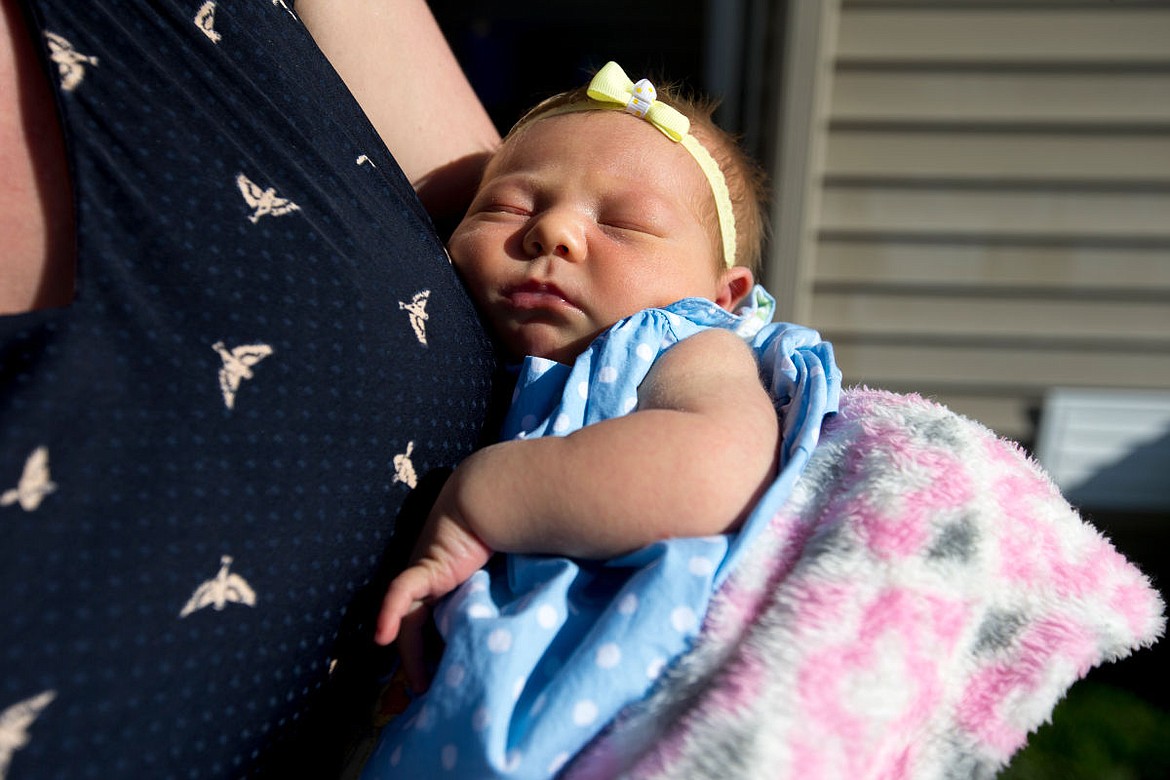 &lt;p&gt;Aurelia Underdahl sleeps on Tuesday in her mother Ashton's arms. When Aurelia was born last week, she broke the Underdahl family's 101-year streak of no girls being born into the family.&lt;/p&gt;