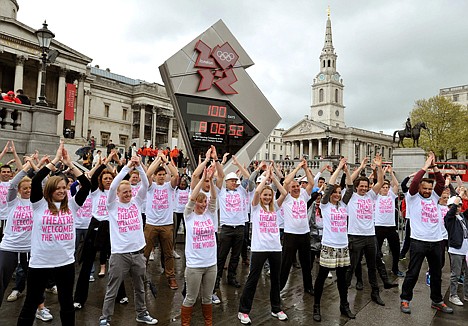 &lt;p&gt;West End theater workers and performers dance in front of the Olympic countdown clock to mark the 100-day countdown, in Trafalgar Square, central London, Wednesday, April 18, 2012. With 100 days to go until the 2012 London Olympics, the city's theater community is increasingly confident that culture won't suffer during a summer devoted to celebrating sport. (AP Photo/PA, John Stillwell) UNITED KINGDOM OUT, NO SALES, NO ARCHIVE&lt;/p&gt;