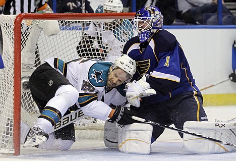 &lt;p&gt;San Jose Sharks' Michal Handzus, of Slovakia, slides into the net as St. Louis Blues goalie Brian Elliott, right, defends during the third period in Game 5 of an NHL Stanley Cup first-round hockey playoff series, Saturday, April 21, 2012, in St. Louis. The Blues won 3-1 and won the series 4-1. (AP Photo/Jeff Roberson)&lt;/p&gt;