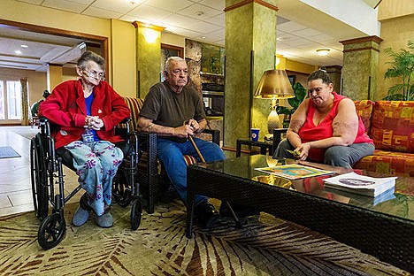 &lt;p&gt;Valerie Yates, left, her husband Richard and their daughter Sharon Yates-Swaving pause with grief while recounting the story of their Rathdrum home burning down last week during an interview Tuesday at the Holiday Inn Express in Hayden, where the family has been staying since the incident.&lt;/p&gt;