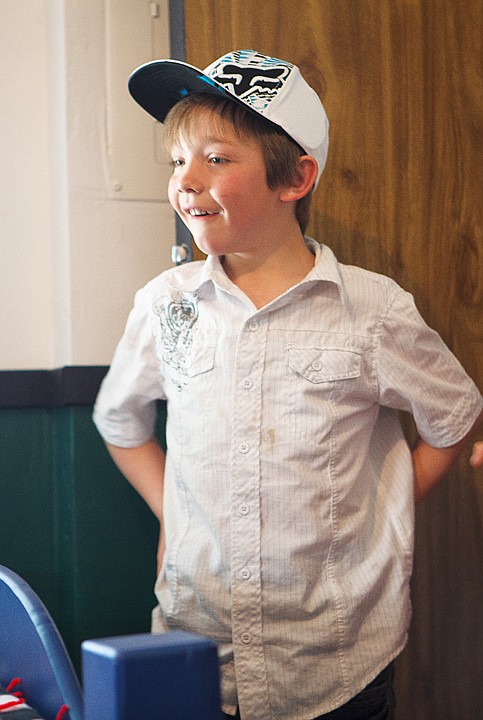 <p>Caleb Speed reacts to seeing his new bedroom Sunday afternoon in Evergreen.</p>