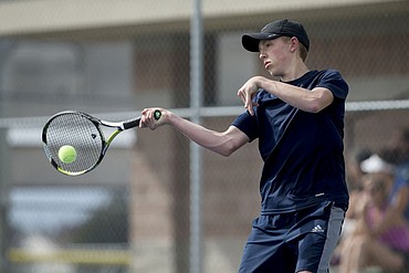 <p>LOREN BENOIT/Press Lake City High School's Jack DuCoeur strikes the tennis ball during a match against Coeur d'Alene High School's Bracken Curtis on Thursday. DuCoeur won both sets, 6-1,6-0.</p>