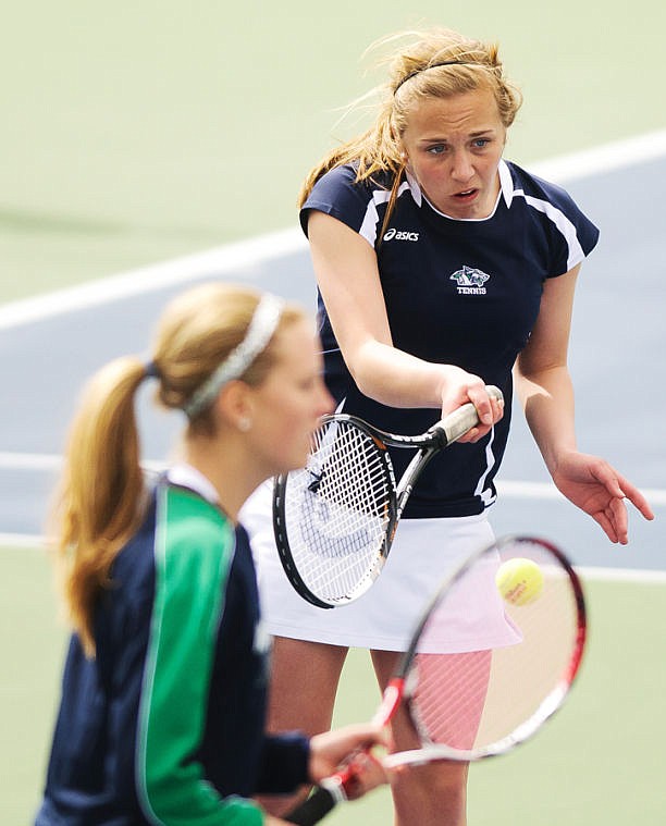 &lt;p&gt;Glacier's Molly Wright (behind) returns a serve Saturday afternoon during a doubles match with her teammate Ingrid Ericksen at the Kalispell Invitational at Flathead Valley Community College. (Patrick Cote/Daily Inter Lake)&lt;/p&gt;