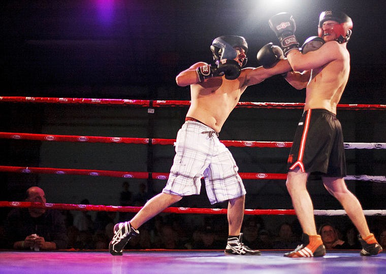 &lt;p&gt;Glacier's Juan Rodriguez (left) lands a punch on Flathead's Cole DeLaughder Thursday night during Fourth Annual Crosstown Boxing Smoker in the Trade Center at the Flathead County Fairgrounds. Rodrieguez won by a split decision.&lt;/p&gt;