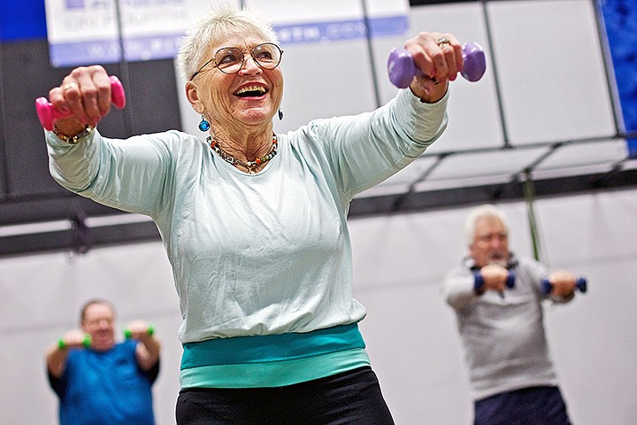 &lt;p&gt;JEROME A. POLLOS/Press Ruth Dixon leads her &quot;SilverSneakers&quot; fitness class Wednesday at Fitness on Fourth in Coeur d'Alene. The program is specifically designed for older adults to improve muscle strength and range of motion.&lt;/p&gt;