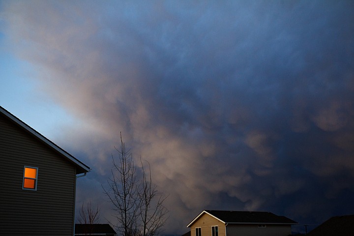 &lt;p&gt;SHAWN GUST/Press Storm clouds form over a subdivision near the Rathdrum Prairie Wednesday in Coeur d'Alene.&lt;/p&gt;