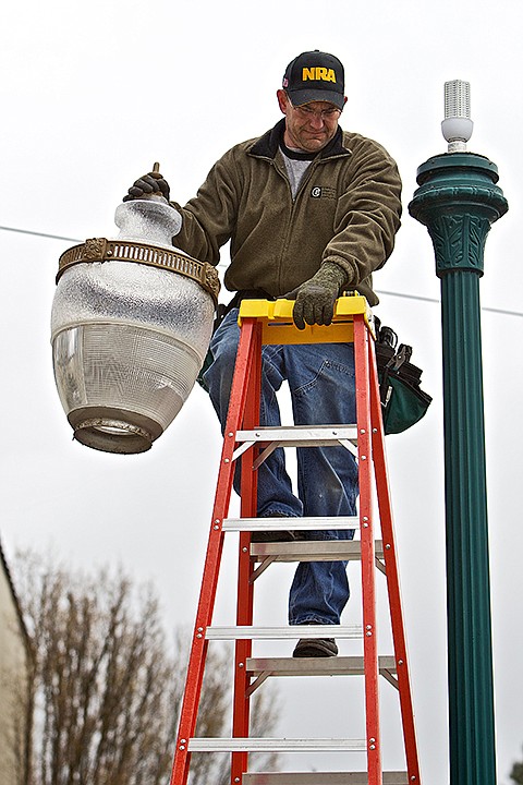 &lt;p&gt;JEROME A. POLLOS/Press Bill Kiley, owner of BK Electrical Services, holds a lamp lens climbing a ladder Wednesday after installing an LED light bulb in one of the streetlights on Second Avenue. Kiley has been replacing the 150-watt bulbs with the new LED which use only 20-watt&#160;but provide the same amount of light. &quot;By installing these lights, I'm basically working my way out of a job because these will last up to 10 years,&quot; Kiley said.&lt;/p&gt;