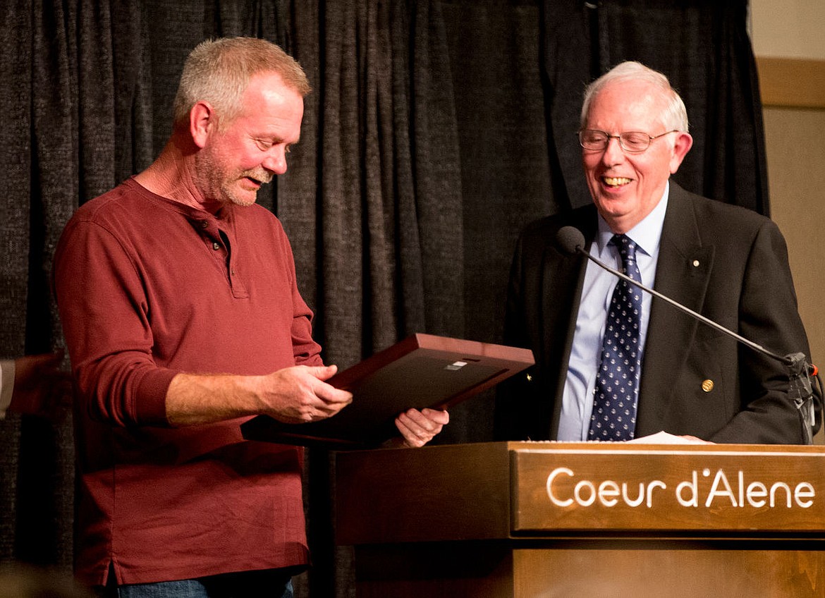 &lt;p&gt;Coeur d'Alene Press reporter Jeff Selle looks at his Kootenai County Task Force on Human Relations' Civil Rights Excellence in Journalism award on Friday as the Task Force's Secretary Tony Stewart looks on.&lt;/p&gt;