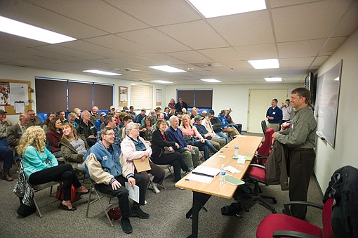 <p>Victor Ketellapper, right, of the Environmental Protection Agency, talks with Columbia Falls residents about cleanup of the CFAC plant during a meeting in the fire hall on April 15.</p>